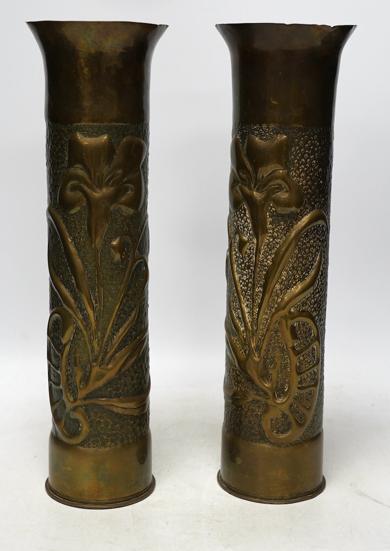 A pair of Trench Art shell case vases, 35cm. Condition - fair